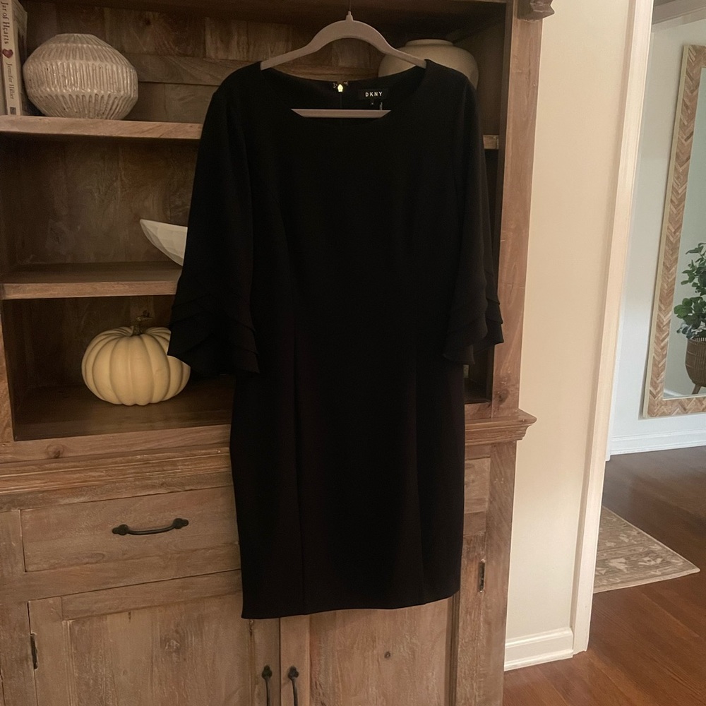 DKNY black open sleeve cocktail dress. Large